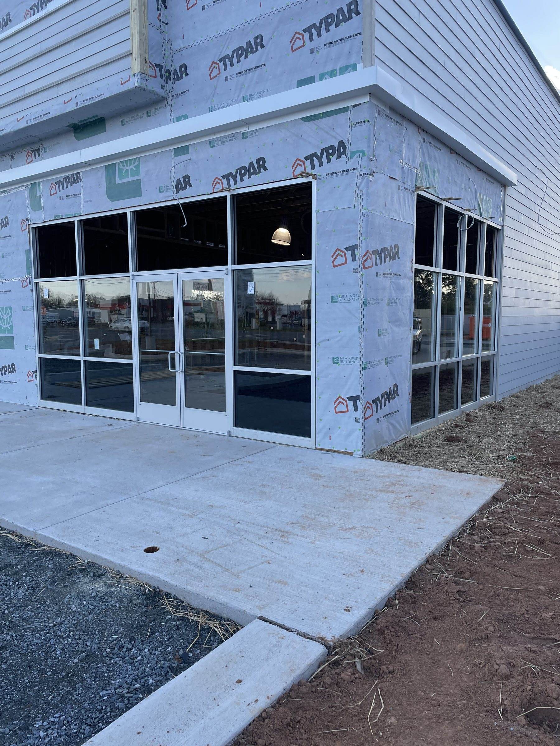 Corner view of the new storefront glazing wrapping the building