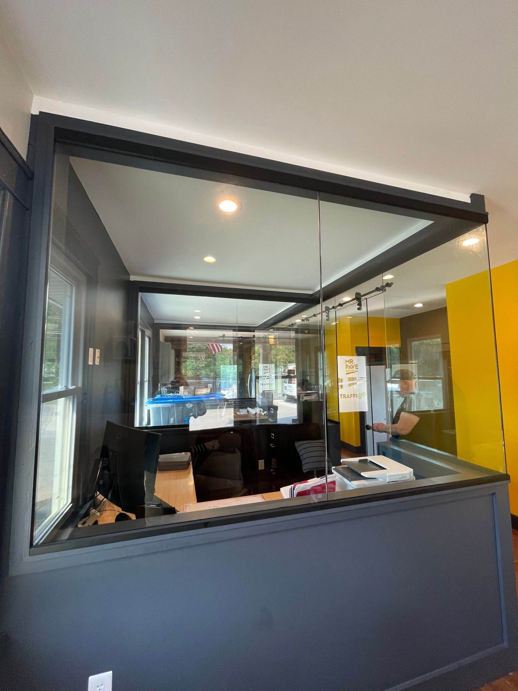 Glass office enclosure with dark trim