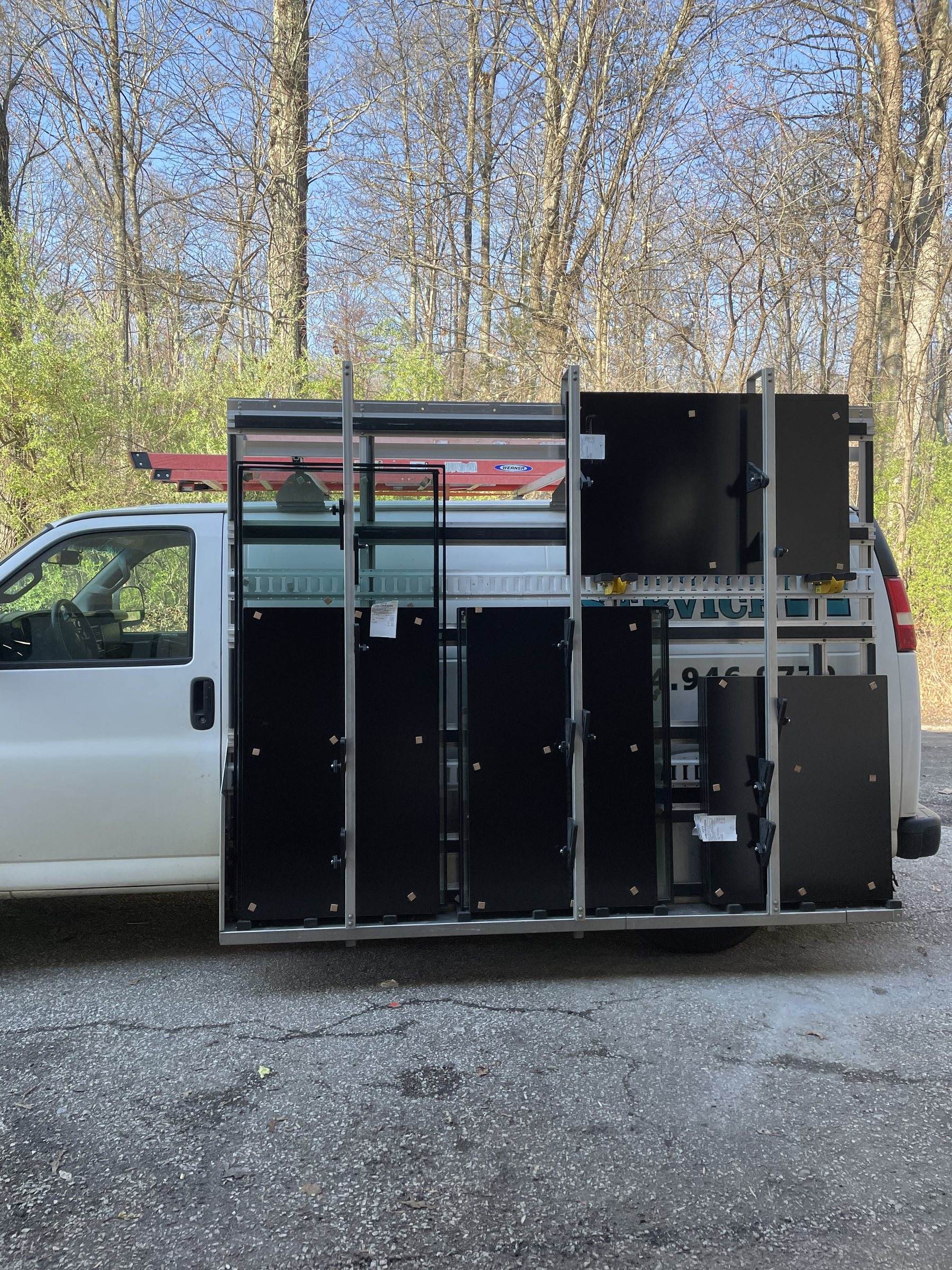 CDSC work truck with a glass rack loaded with panels